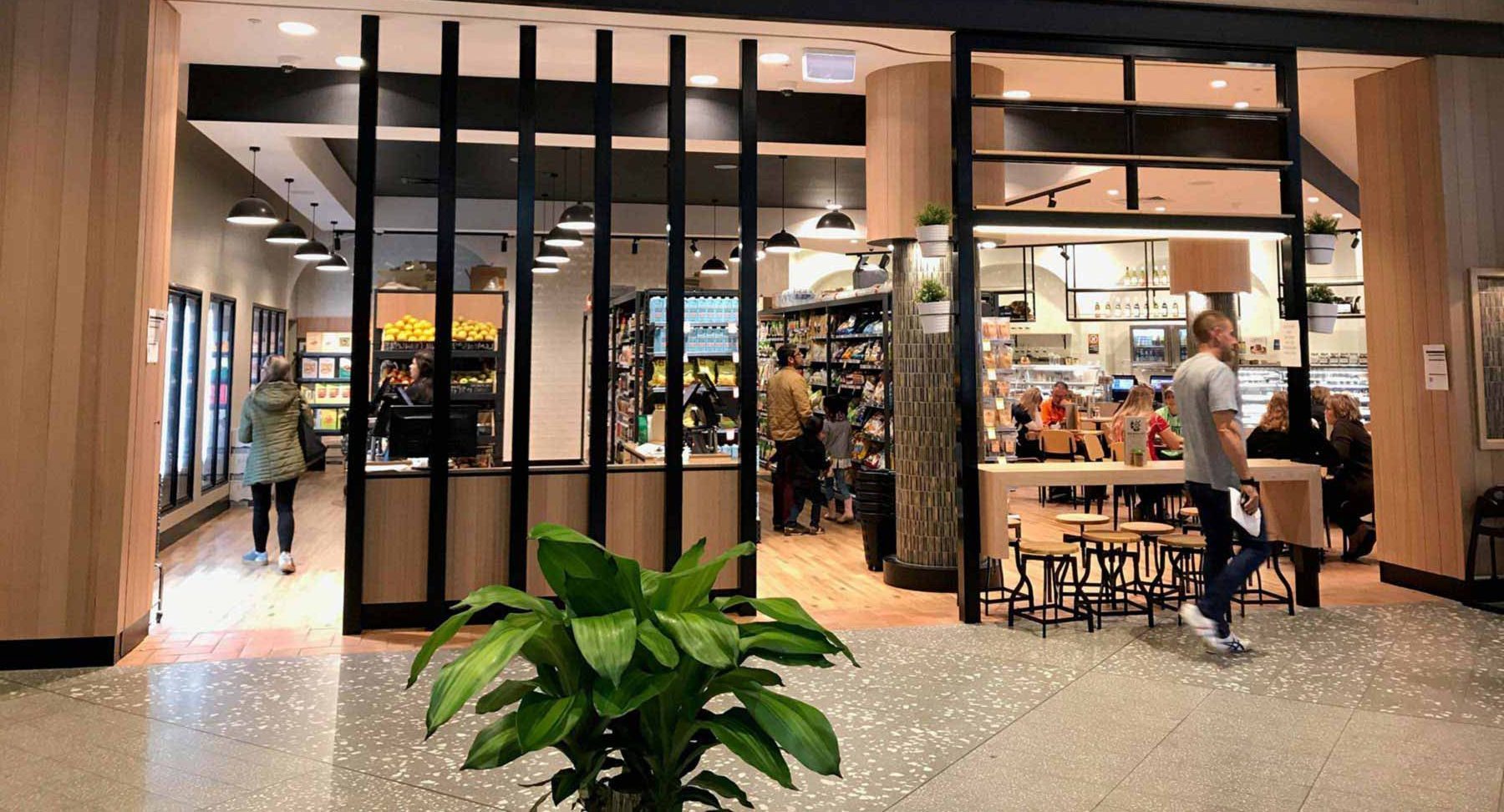 retail shop owner serving customers in a shopping centre in Sydney